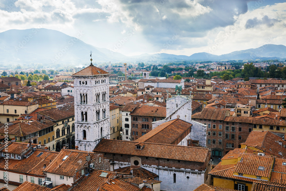 Scenic view of St. Michael Church (Chiesa di San Michele in Foro) from Torre delle Ore. Location Lucca, Tuscany, Italy. Picturesque travel destination postcard.