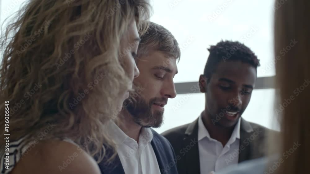 Close up shot of colleagues discussing project details with their boss and brainstorming ideas related to it Close up shot of colleagues discussing project details with their boss and brainstorming ideas related to it