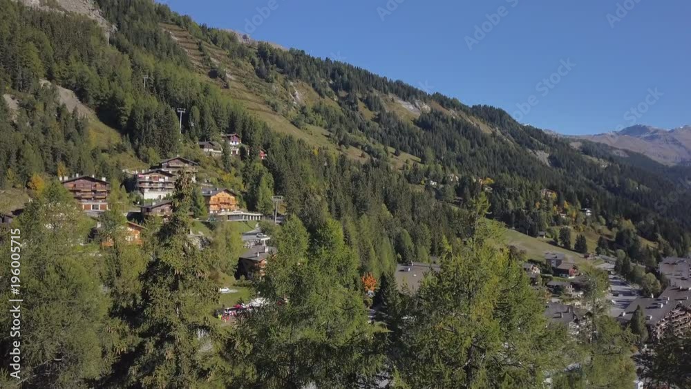 custom made wallpaper toronto digitalSwiss mountain aerial shot. Cinematic drone shot - camera rising to discover a little village nested in the alps
