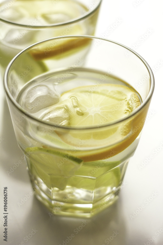water with lemon and limes and ice. water with lemon and limes and ice.