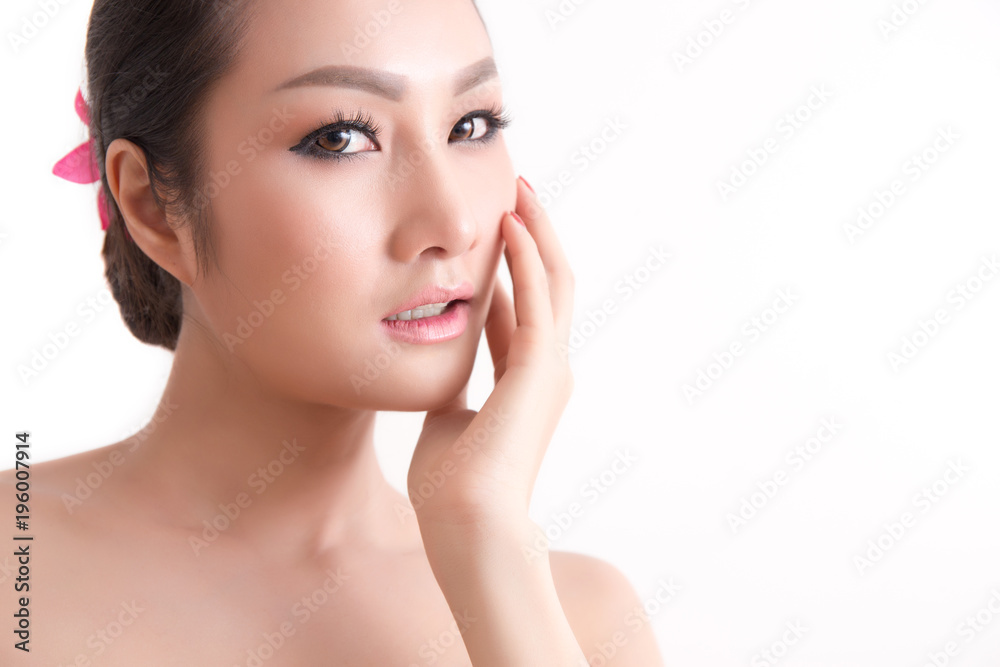 Asian girl with healthy facial skin touching her face with white background, studio shot for Thai spa looking