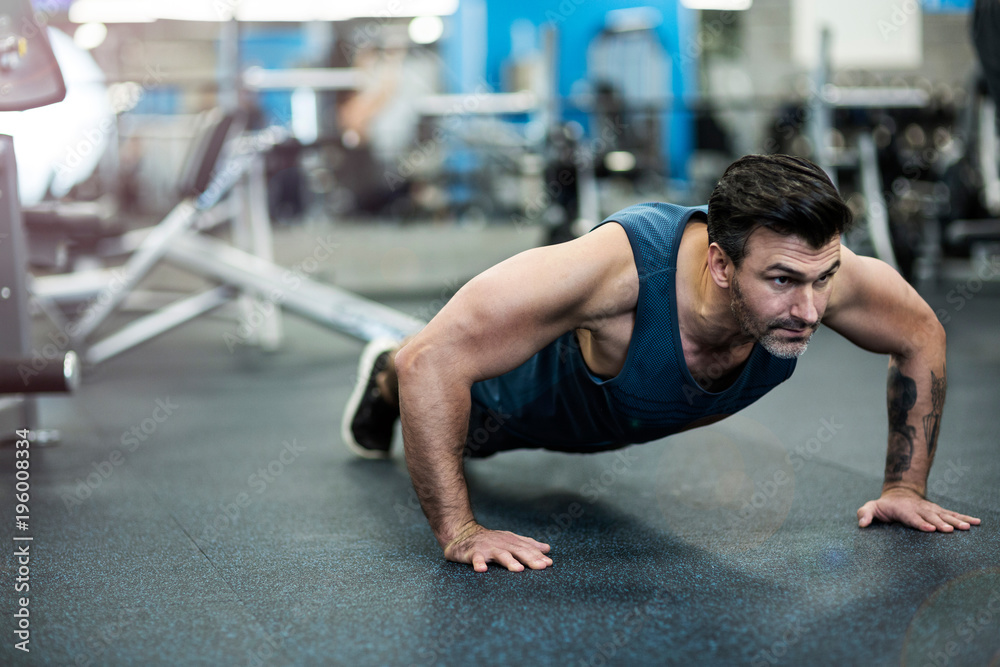 Man exercising in gym
