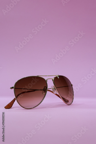 Isolated sunglasses on pink background