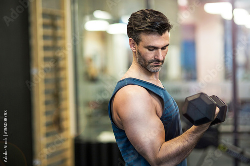 Man exercising in gym  