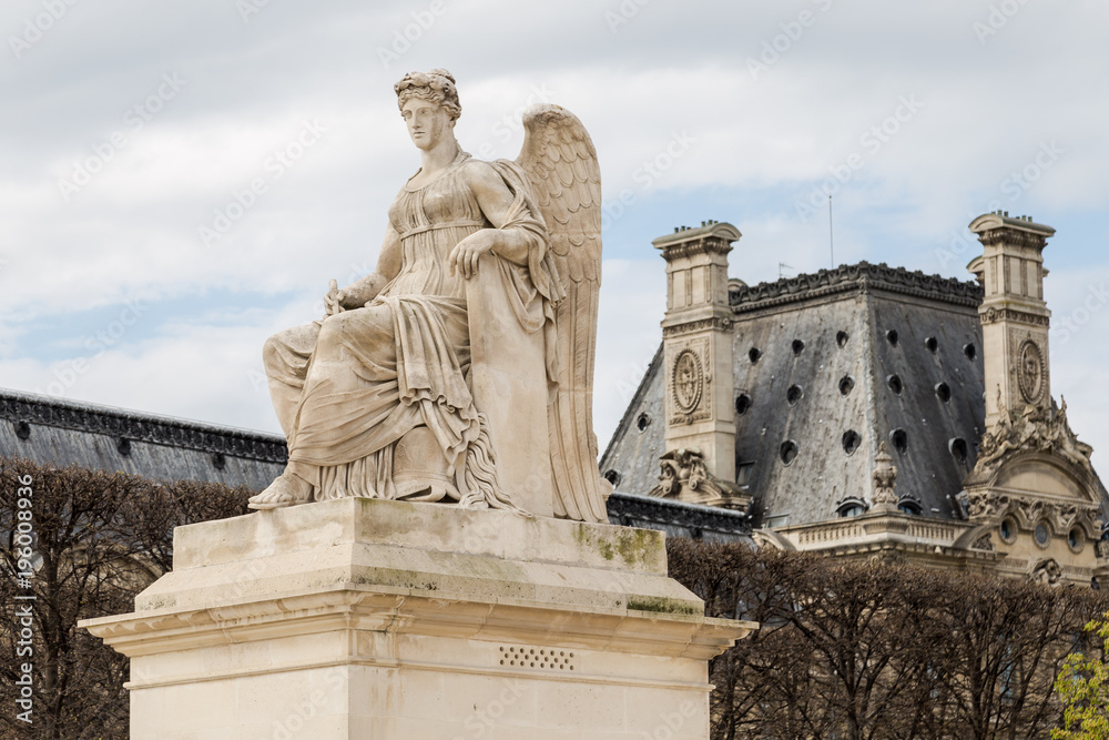 Angel statue at Triumphal Arch Arc de Triomphe du Carrousel at Tuileries. The monument was built between 1806 - 1808 to commemorate Napoleon's military victories