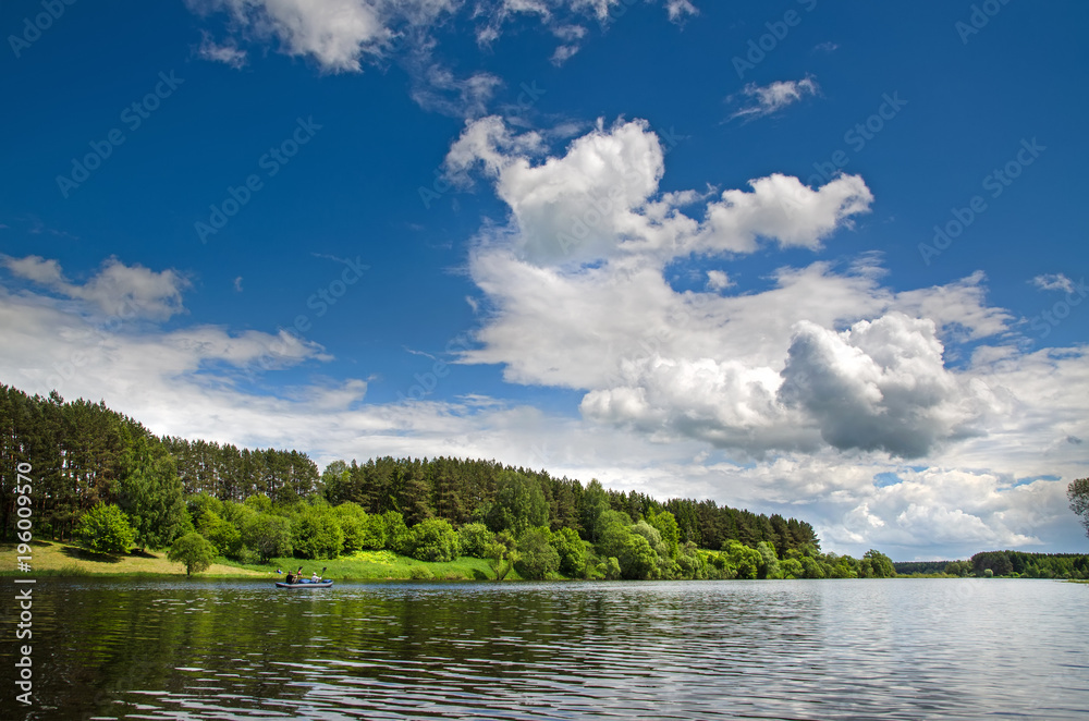 The lake is surrounded by trees along the banks