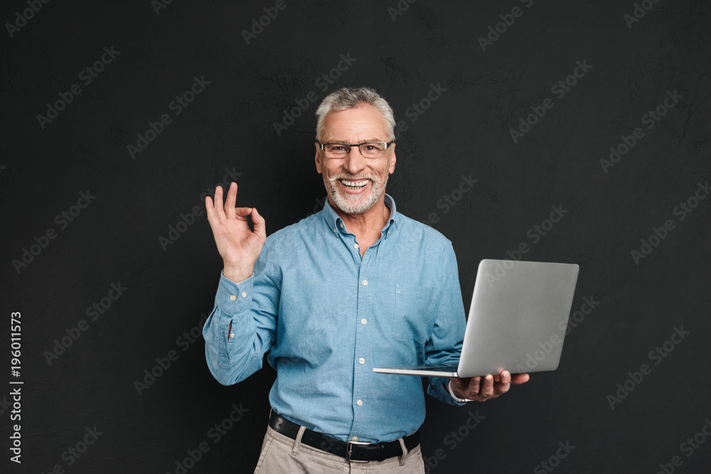 Portrait of a cheerful mature man dressed in shirt Portrait of a cheerful mature man dressed in shirt