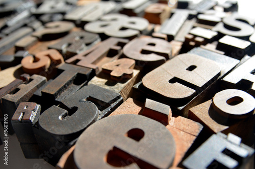 Photo of wooden letterpress closeup, various typefaces photo