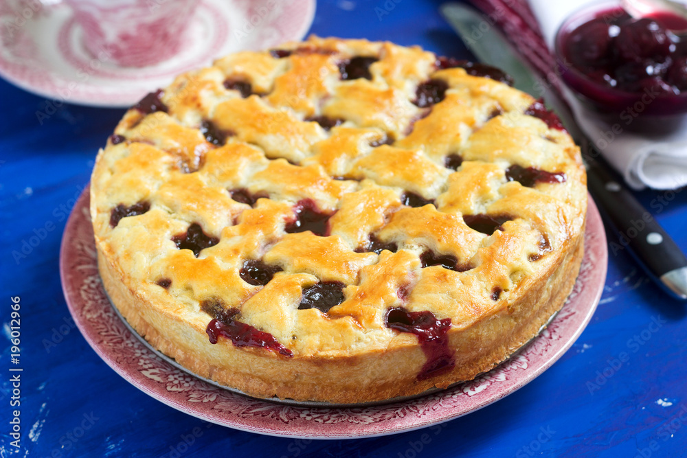A traditional American or European cherry pie made of shortcake. Rustic style. A traditional American or European cherry pie made of shortcake. Rustic style.