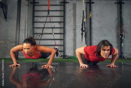 Man and woman working out in gym