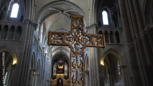 Christianity - Crucifix in a cinematic cathedral nave. Cross lightened, heaven light in a beautiful church
