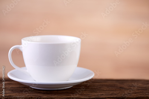 Two white porcelain teacups on white table show clean and simple design ideas, selective focus