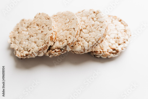 Crisp bread slices isolated over white background, healthy breakfast