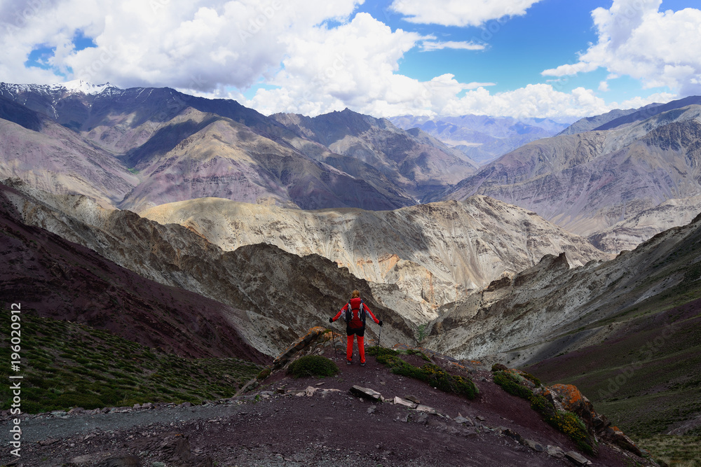 Traveller on the trekking in Ladakh, Karakorum panorama. This region is a purpose of motorcycle expeditions organised by Indians