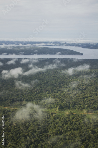 Aerial view of the Amazon rain forest. Small clouds over the river and jungle. São Gabriel da Cachoeira, Amazon / Brazil