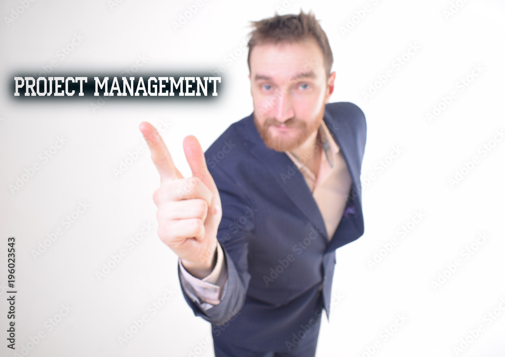 A businessman shows an inscription:PROJECT MANAGEMENT A businessman shows an inscription:PROJECT MANAGEMENT