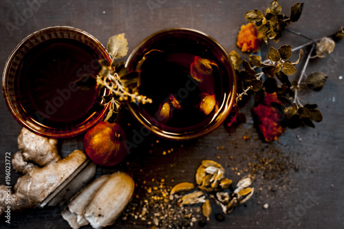 Close up of an traditional sumer drink i.e. PANAKAM with all its ingredients on a wooden surface in dark Gothic colors. photo