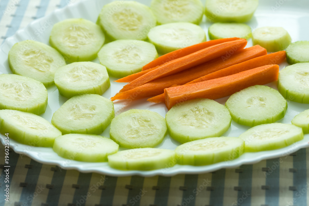 Tray of cucumbers and carrots Tray of cucumbers and carrots
