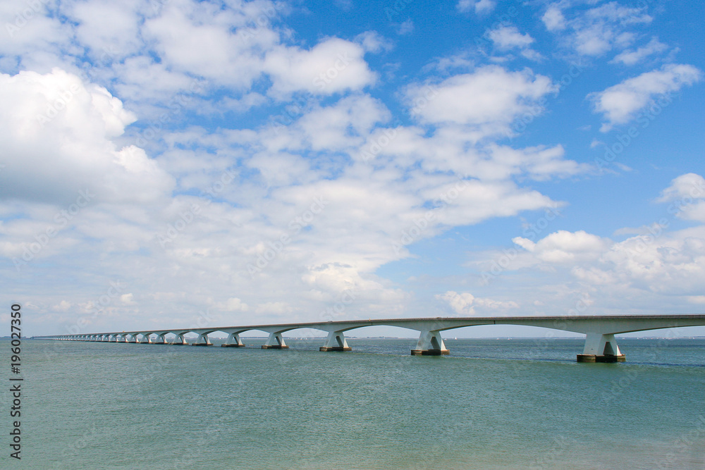 Obraz premium Zeeland bridge near Walheren Netherlands - white modern bridge over blue water
