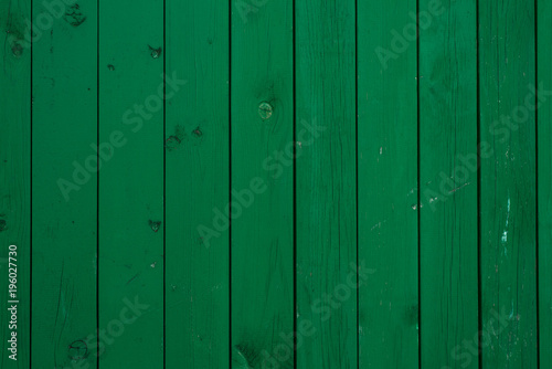 Green wooden board with knots - wooden background