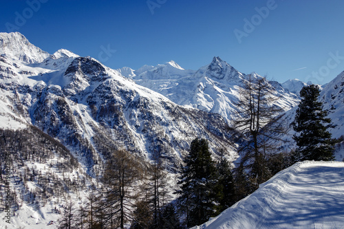 Amazing view on the Zinal Grimentz ski resort on a bright sunny Winter day in  Val d'Annviers, Switzerland. One of the best ski areas in the European Alps. Views on the Weißhorn and Matterhorn photo