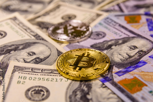 Bitcoins on the one hundred dollar bills