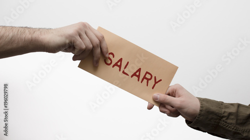 Hand giving and receiving mail with salary on the white background. Salary payment and cheque concept