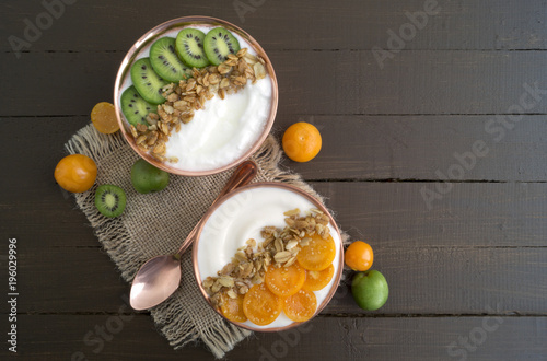 Natural healthy yogurt with muesli and fruit. photo