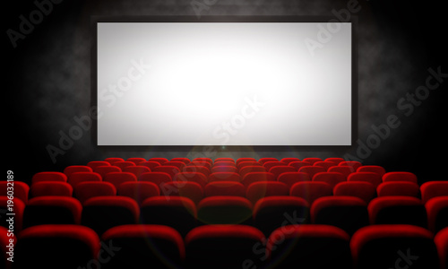 white screen and red seats in empty movie theater
