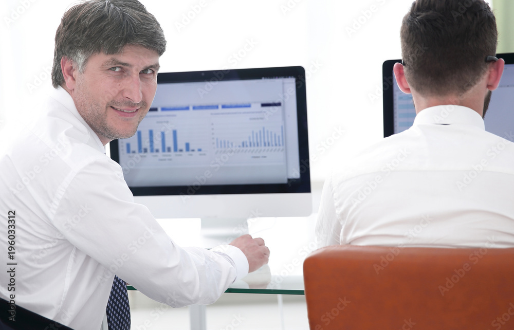 Economists of the company compile financial charts