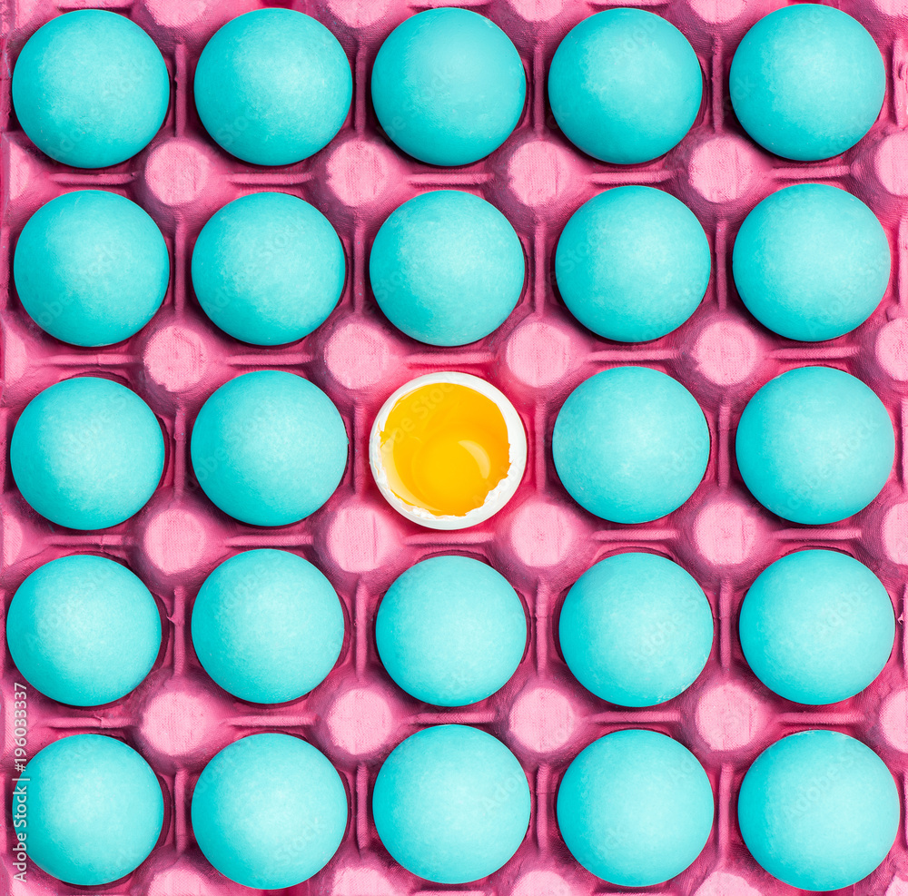 Tray with blue eggs and one with yolk Tray with blue eggs and one with yolk