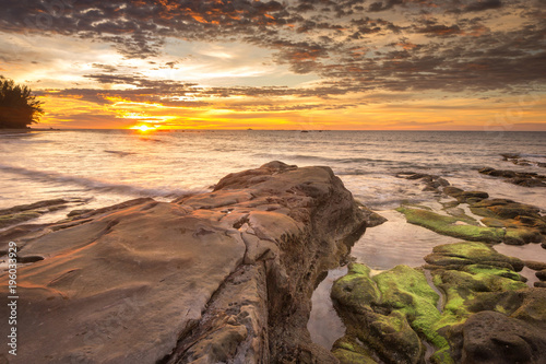 sunset seascape with natural coastal rocks. nature composition