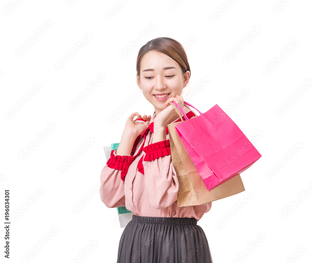 A girl with shopping bags. Shopping woman smiling. Isolated over white background. A girl with shopping bags. Shopping woman smiling. Isolated over white background.