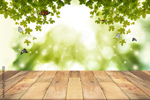 Brown Wooden table with green blurred background. Empty table for display product. © Forrest9
