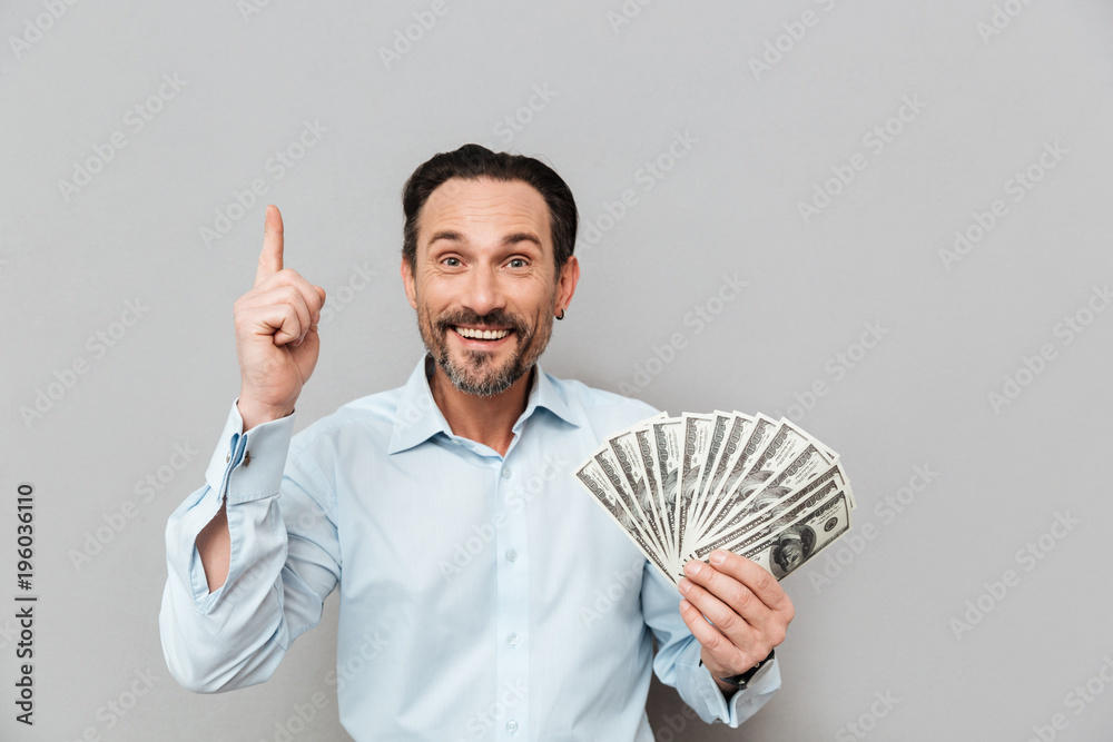 Portrait of a satisfied mature man dressed in shirt Portrait of a satisfied mature man dressed in shirt