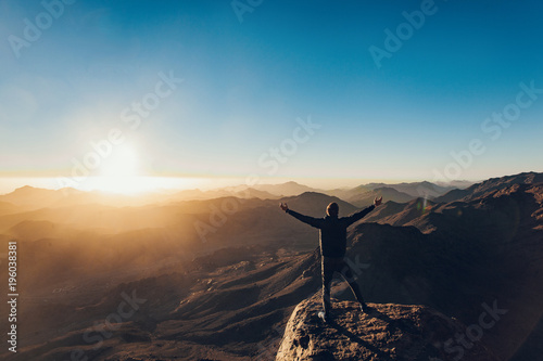 Man meditates on Mount Sinai in Egypt at sunrise. © Stanislav