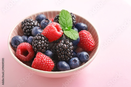 Berry  raspberry  blueberry  blackberry  fruits bowl on a pastel background. 