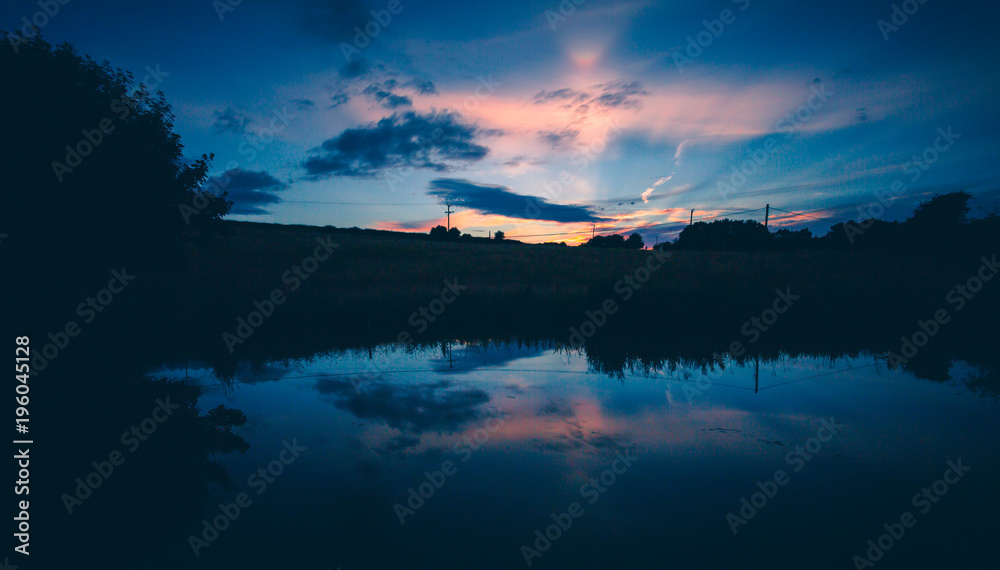 english countryside sunset lake reflection