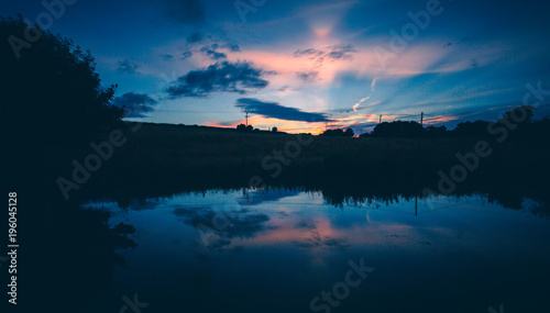 english countryside sunset lake reflection