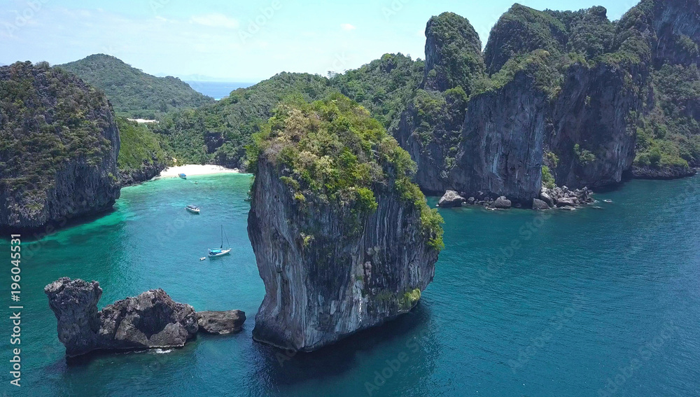 AERIAL: Majestic limestone karst overlooking sandy bay on a breathtaking day.