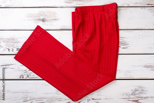 Cuadro en lienzo Red folded striped trousers
