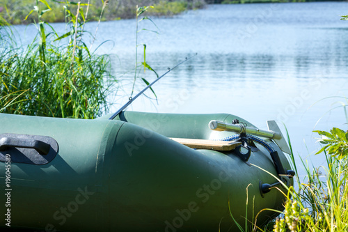 Inflated rubber boat for fishing on the shore
