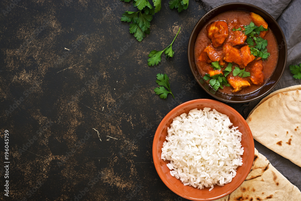 Traditional Indian dish chicken Tikka masala. Top view, copy space. Traditional Indian dish chicken Tikka masala. Top view, copy space.