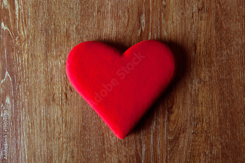 symbol of a red heart on a wooden table