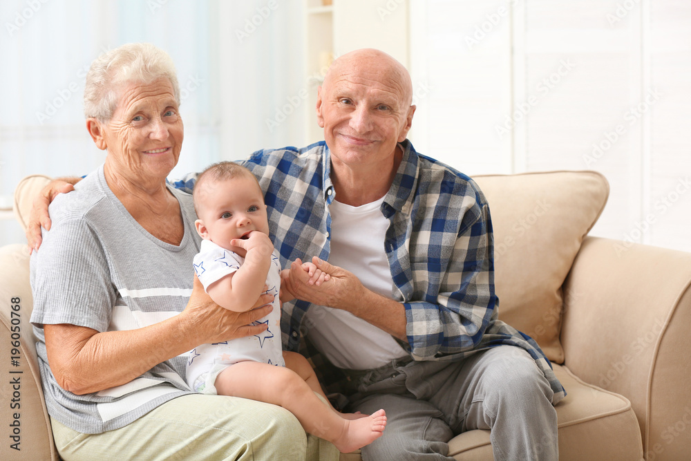 Senior couple with their little grandchild resting at home Senior couple with their little grandchild resting at home