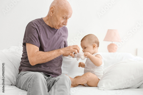 Senior man playing with his...