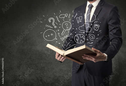 Businessman holding a book.