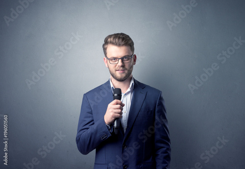 Businessman holding microphone