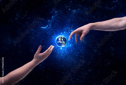 Hands in space touching planet earth