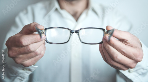 Optician showing glasses.
